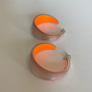 Alexis bitter medium wide graduated hoop earrings, warm silver lucite